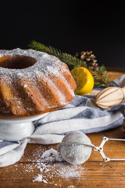 Free photo chocolate cake and sugar strainer