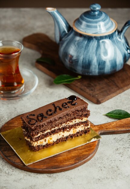 Chocolate cake with glass of tea