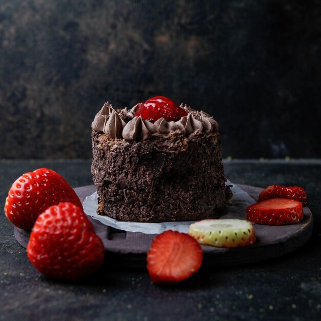 chocolate cake with strawberry in round plate