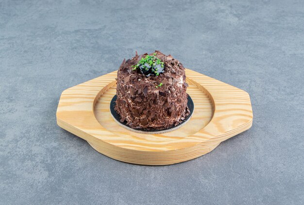 chocolate cake on wooden plate.