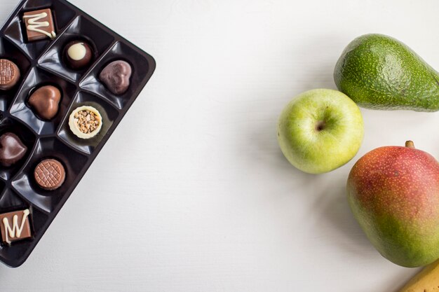 Chocolate candies and fruits