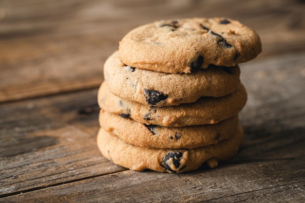 Chocolate chip cookies close up on a wooden background