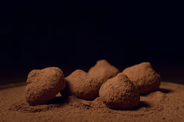 Chocolate coffee truffles black background