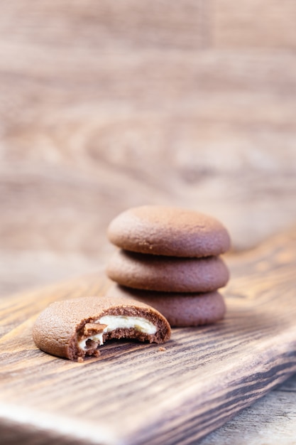 Chocolate cookie on a wooden cutting board