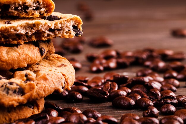 Chocolate cookies stand on coffee beans