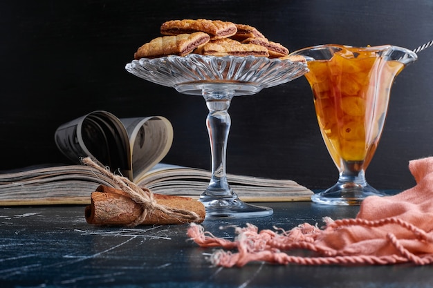 Chocolate crackers with cherry confiture in glass dishes. 