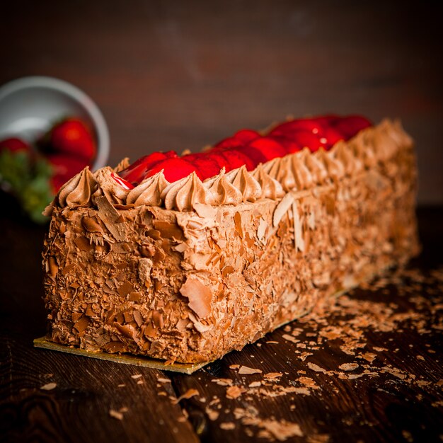 chocolate cream cake with chocolate chips and strawberry