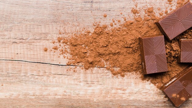 Chocolate and crumbs on wooden table