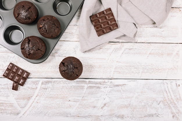 Chocolate cupcake on white wooden table