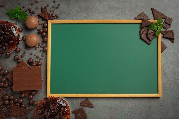 Chocolate on the dark surface. World Chocolate Day concept