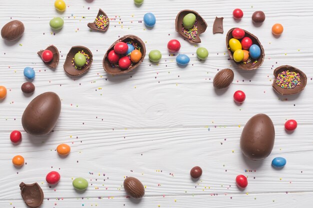 Chocolate eggs with candies and sprinkles