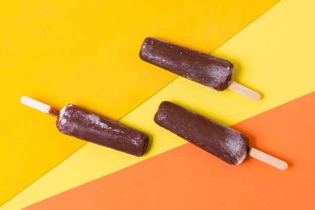 Chocolate flavor for ice cream on stick on table