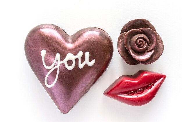 Chocolate heart and chocolate rose with red mouth