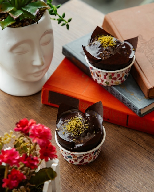 Chocolate muffin sprinkled with grated pistachio