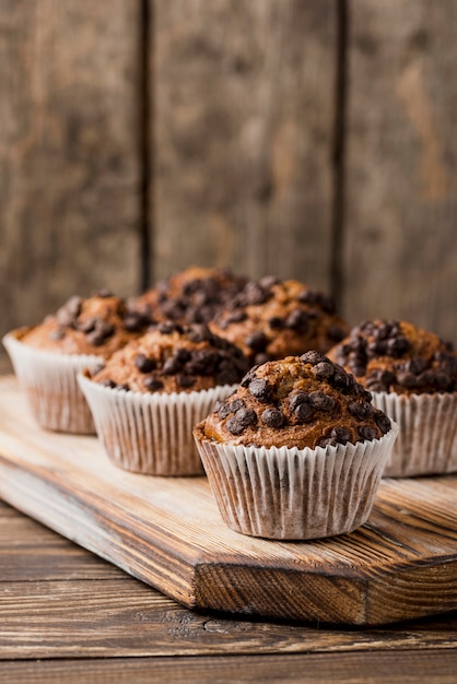 Chocolate muffins on wooden board