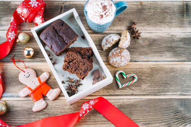 Chocolate pie with gingerbread on table