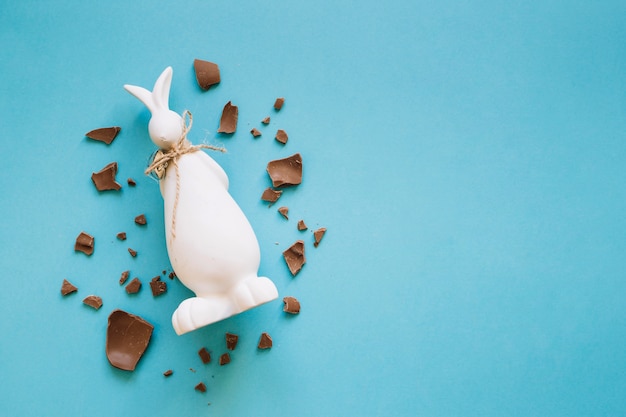 Chocolate pieces around bunny statuette