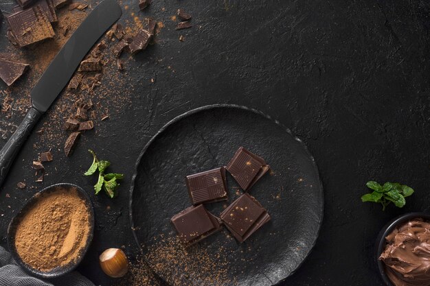 Chocolate pieces on plate top view