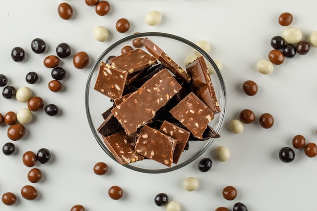 Chocolate pieces with chocoballs in a glass bowl