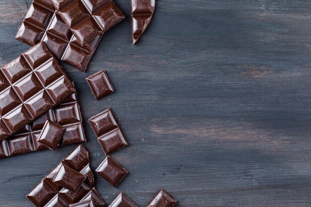 Chocolate pieces on wooden table