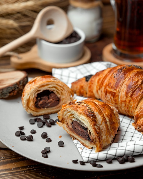 Chocolate puff pastry croissant sprinkled with chocolate chips