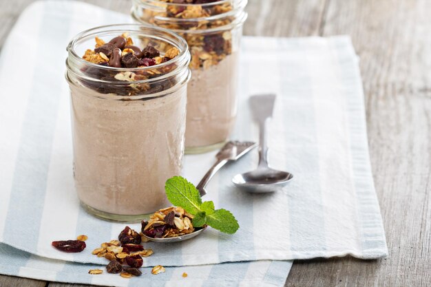 Chocolate smoothie with granola for breakfast
