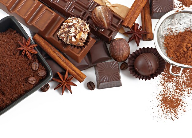 Chocolate and spices isolated on white