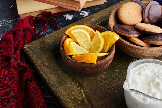 Chocolate sponge cookies with citrus fruits. 