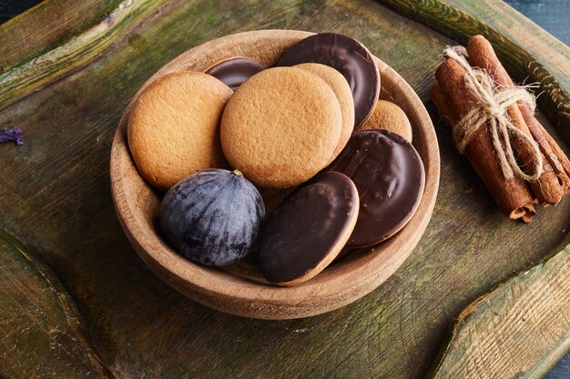 Chocolate sponge cookies in a wooden cup. 