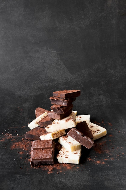 Free photo chocolate tower composition on dark background