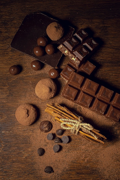 Chocolate and truffles on wooden background