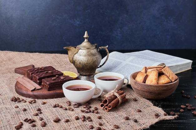 Chocolate waffles with a cup of tea and crackers.