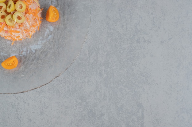 Chopped carrot salad with marinated green olives