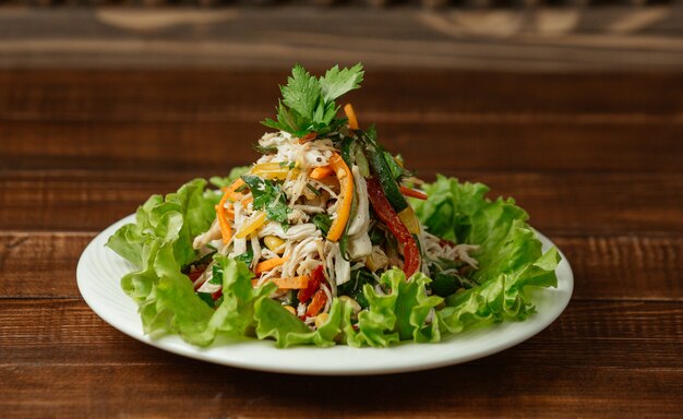 Chopped and minced chicken mushroom salad with colorful bell peppers and fresh parsley