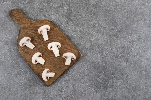 Chopped Organic mushrooms on wooden board