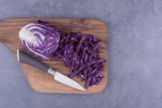 Chopped purple cabbage on a wooden platter