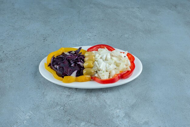 Chopped vegetable salad in a white plate.