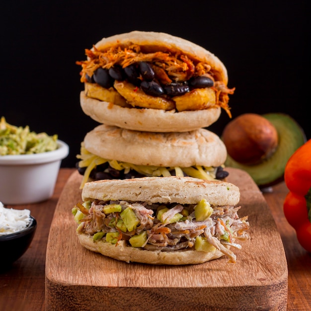 Chopping board with assortment of arepas