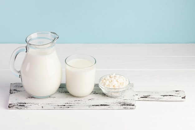 Chopping board with milk and cheese