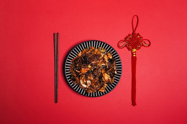 Free photo chopsticks and decoration near asian food