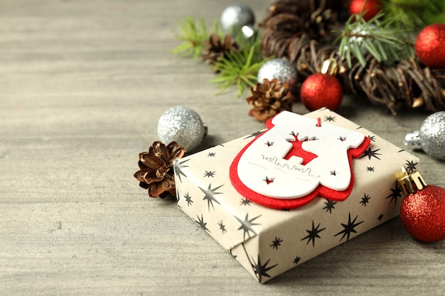 Christmas accessories on wooden background, space for text.