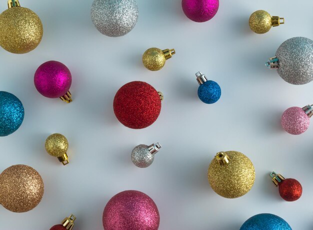 Christmas background pattern made of colorful christmas baubles happy new year wallpaper flat lay