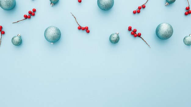 Christmas background with blue balls and mistletoe