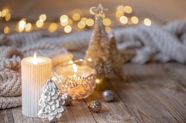 Christmas background with burning candle and decor details