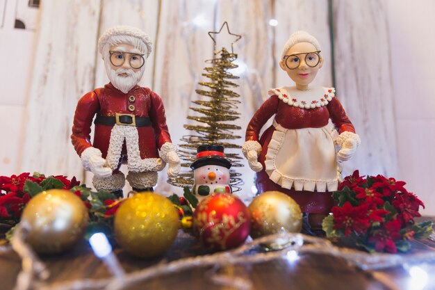Christmas background with male and female santa