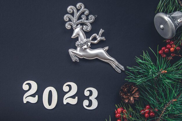 Christmas background with numbers 2023 and decor details flat lay