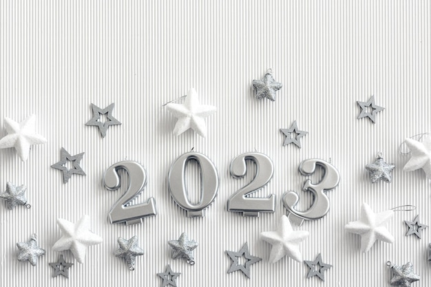 Christmas background with numbers 2023 and decor on a white background