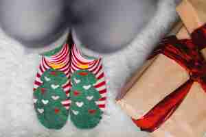 Free photo christmas background with person wearing winter socks
