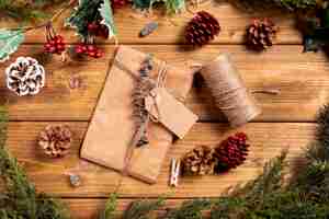 Free photo christmas background with present and pine cones
