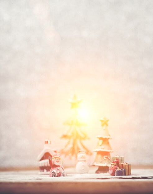 Christmas background with santa claus and a snowman